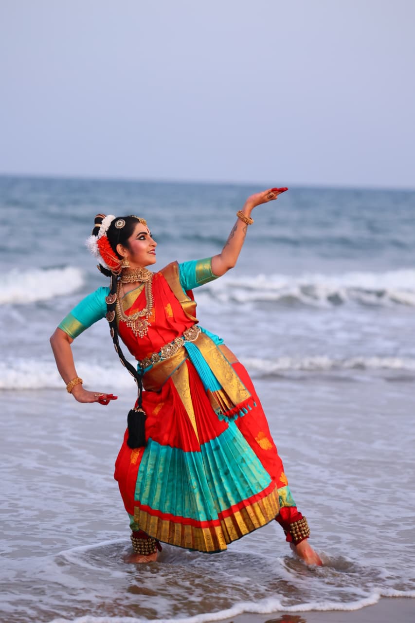 A Bharatanatyam pose by the shore