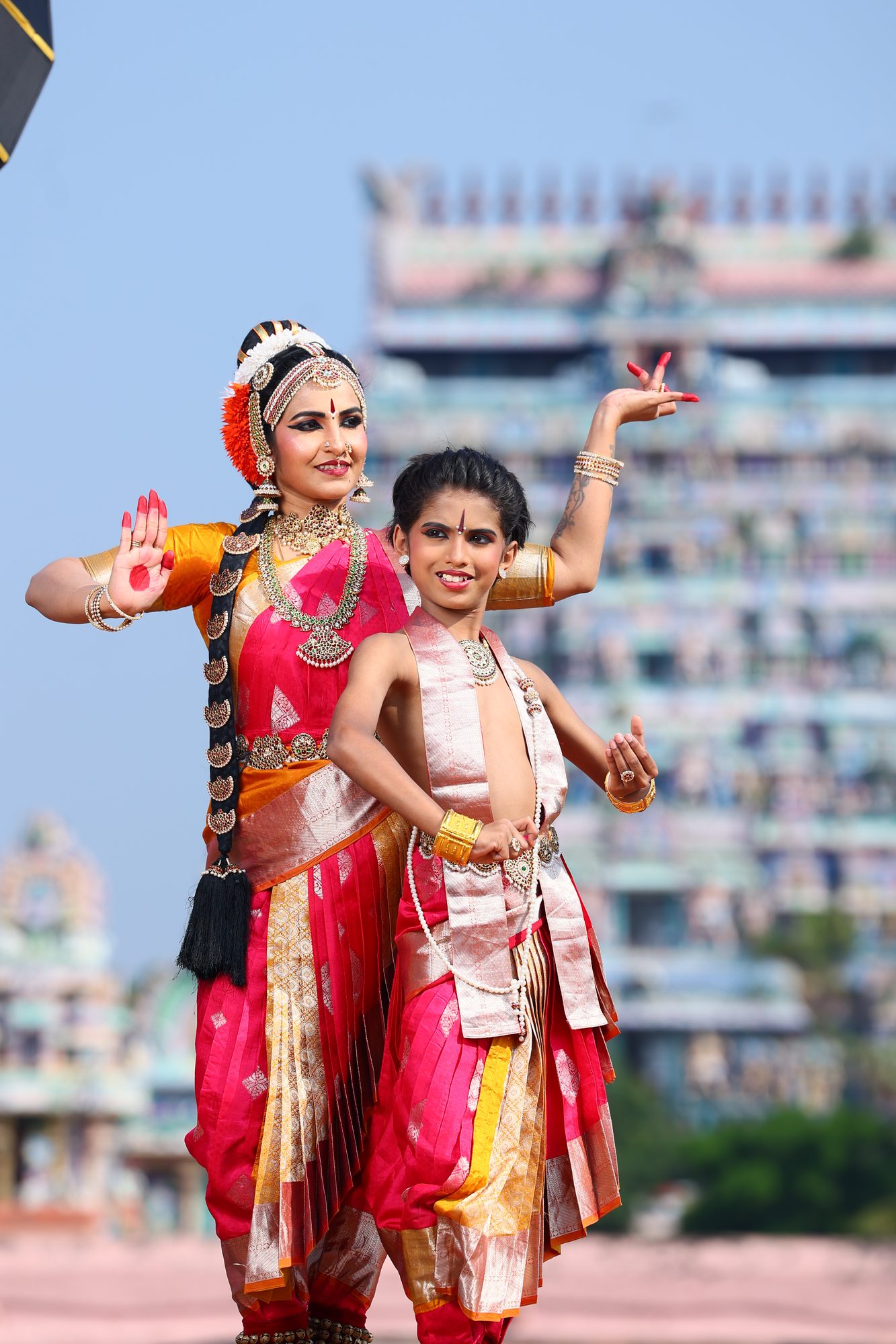 Smt. Pooja Raj dancing alongside a young student